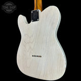 The back of a Fender Telecaster-style electric guitar with a natural maple wood finish, shown against a solid black background. A Tone Shop watermark is visible in the top-left corner.