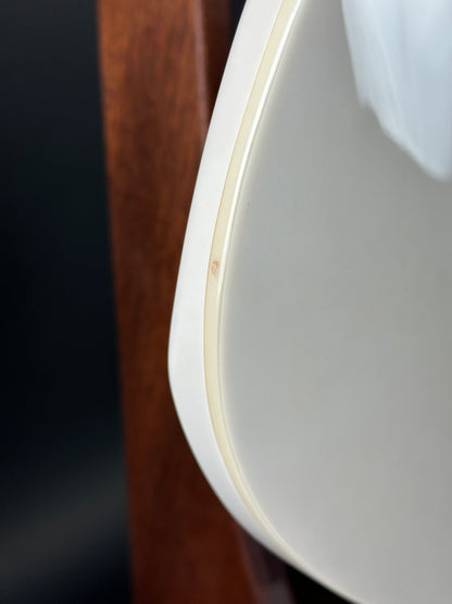 Close-up of a white ceramic plate on a wooden surface