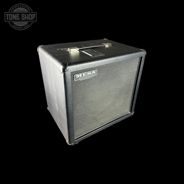 Guitar amplifier cabinet with Mesa Boogie logo on a black background