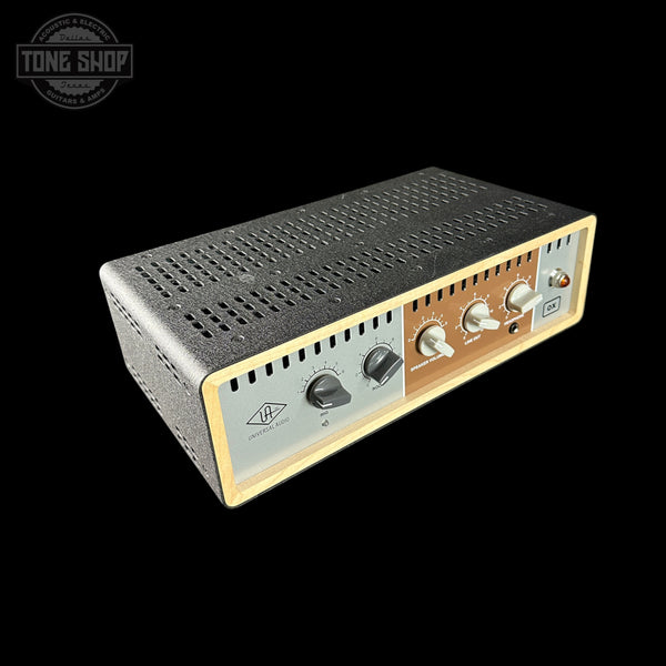 Vintage-style audio amplifier with control knobs on a black background, featuring the Tone Shop logo.