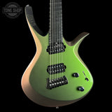A green electric guitar with a metallic gradient finish, black hardware, and a black neck, shown against a solid black background with a Tone Shop watermark in the top left corner.