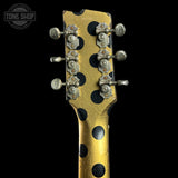 Back of headstock of Rock N Roll Relics Revenge Jr Gold W/Black Polka Dots Relic.