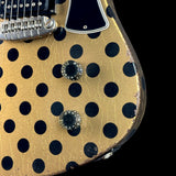 Front detail of Rock N Roll Relics Revenge Jr Gold W/Black Polka Dots Relic.