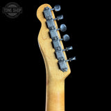 Guitar headstock with tuning pegs on a black background, featuring the Tone Shop logo.