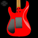 Red electric guitar with a black pickguard on a black background, featuring 'Tone Shop' logo.
