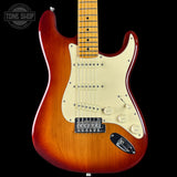 Electric guitar with a sunburst finish on a black background, featuring the Tone Shop logo.