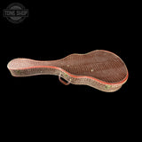 A vintage guitar case with a brown crocodile skin pattern and red trim, shown against a solid black background with a Tone Shop logo in the top left corner.