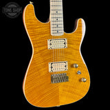 Electric guitar with a sunburst finish on a black background, featuring 'Tone Shop' branding.