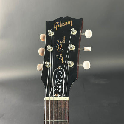Gibson Les Paul Junior guitar headstock on a gray background