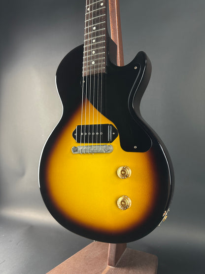 Electric guitar with a sunburst finish on a gray background
