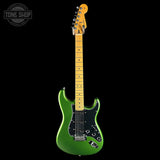 A green electric guitar with a maple neck and headstock, shown against a solid black background. A Tone Shop watermark is visible in the top-left corner.