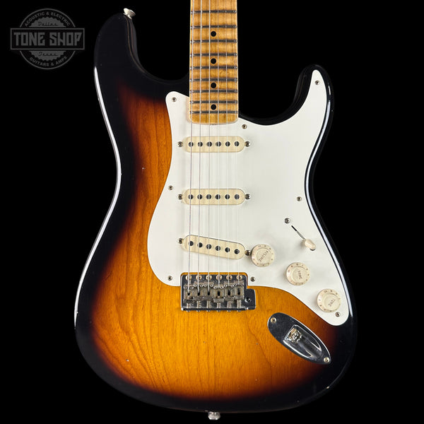 Electric guitar with a sunburst finish on a black background, featuring the Tone Shop logo.