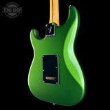 A green electric guitar body shown from the back against a black background, with a visible Fender logo badge and a Tone Shop watermark in the upper left corner.