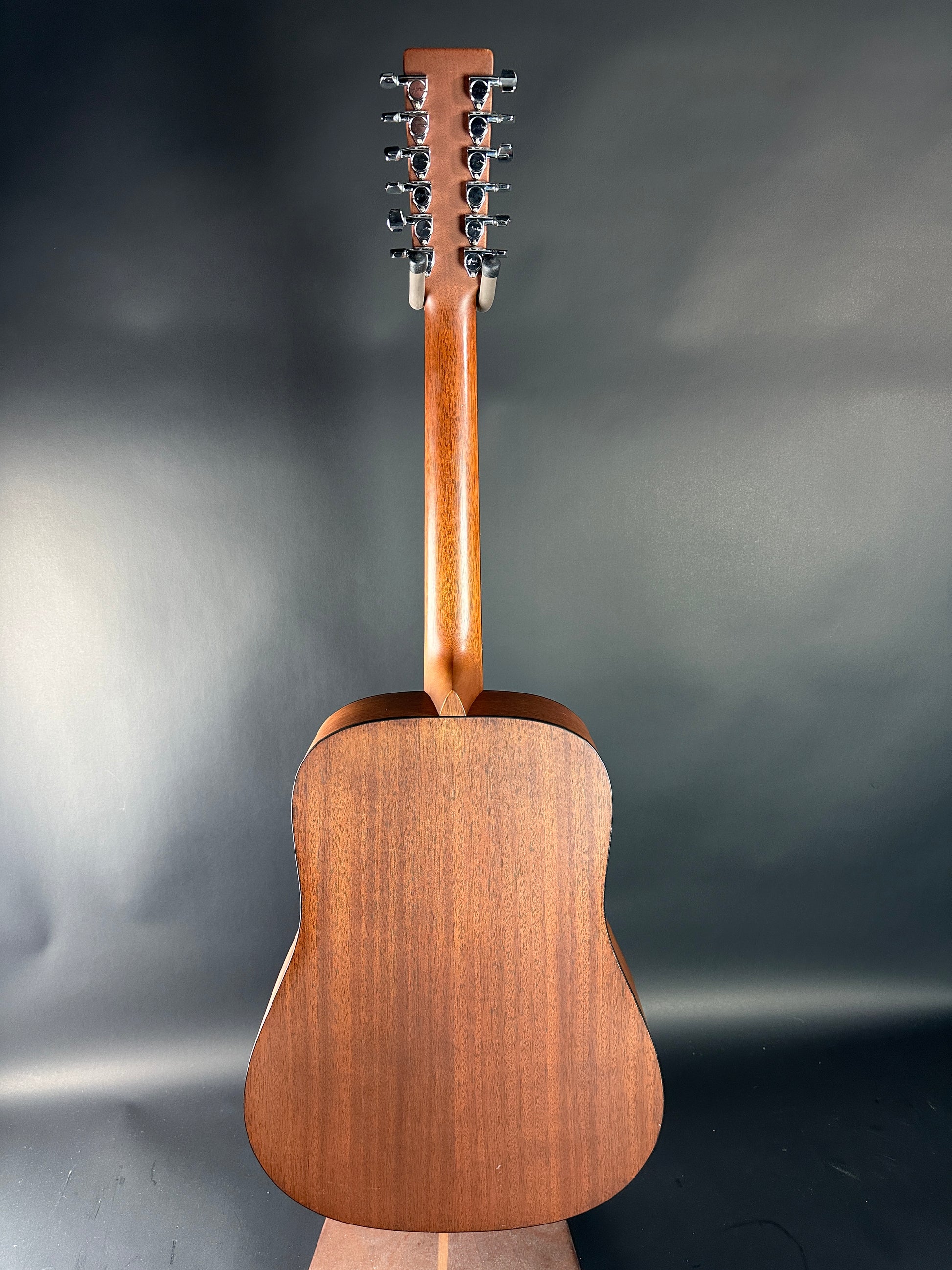 Wooden 12-string guitar on a dark gray background