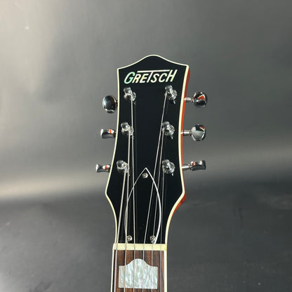 Gretsch guitar headstock on a dark background