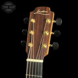 Guitar headstock with brand logo on a black background