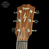 Taylor guitar headstock with brand logo on a black background