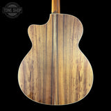 Wooden guitar back with 'Tone Shop' logo in the corner