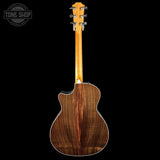 Wooden acoustic guitar on a black background with 'Tone Shop' logo.