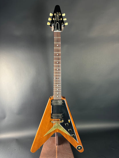 Guitar headstock on a reflective gray surface