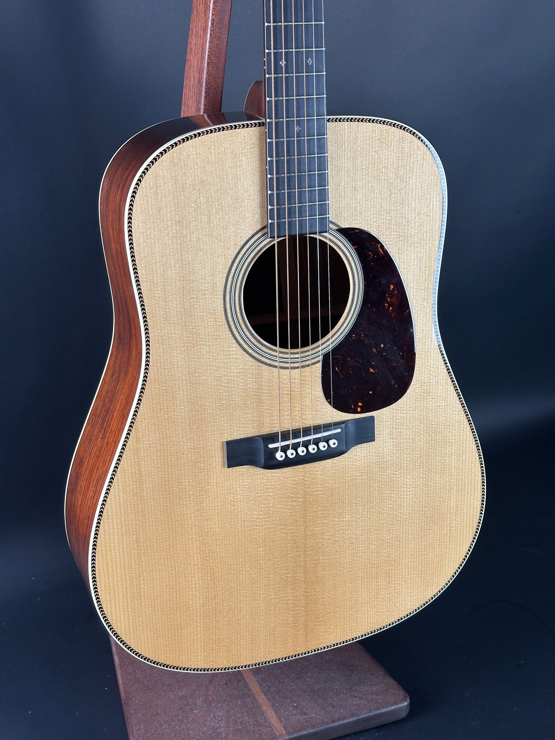Acoustic guitar with a dark blue background