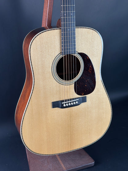 Acoustic guitar with a dark blue background
