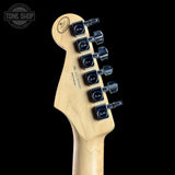 Guitar headstock with tuning pegs on a black background, featuring the Fender logo.