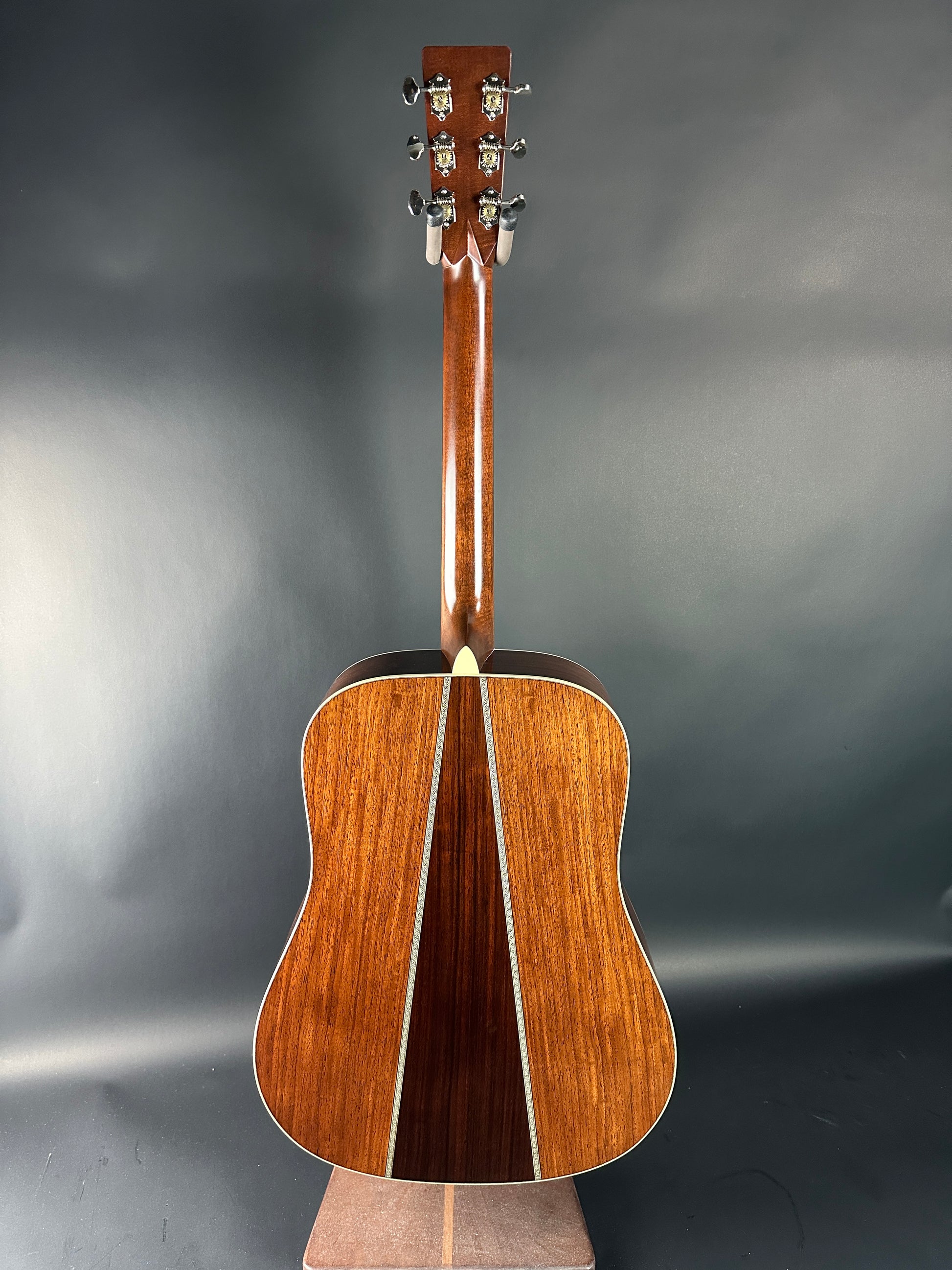 Acoustic guitar on a gray background