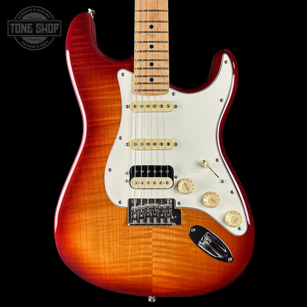 Electric guitar with a sunburst finish on a black background, featuring 'Tone Shop' branding.