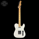 A white electric guitar with a maple neck and black hardware, shown against a solid black background with a Tone Shop logo in the top-left corner.