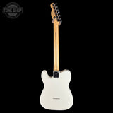 A white electric guitar shown from the back against a solid black background, with a light natural wood neck and a Tone Shop watermark in the upper left corner.
