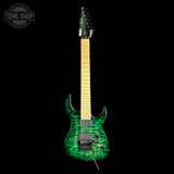 A double-cutaway electric guitar with a vibrant green and black wavy flame maple body, a light maple neck, and black hardware, shown against a solid black background with a Tone Shop watermark in the top-left corner.