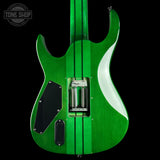 The back of a green electric guitar with a glossy metallic green finish, black pickguard, and silver hardware, shown against a solid black background with a Tone Shop watermark in the top left corner.