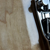 Close-up of a metal object on a wooden surface