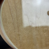 Close-up of a textured surface with a white area and brown edges.