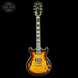 An Ibanez electric guitar with a sunburst finish, shown vertically against a solid black background. The headstock features the Ibanez logo, and a 'TONE SHOP' watermark is visible in the top-left corner.