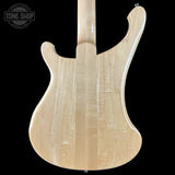 Back view of a guitar body with 'Tone Shop' logo in the corner.