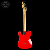 A red Fender Telecaster electric guitar shown from the back, featuring a glossy red body, natural wood neck, and black tailpiece, photographed against a solid black background.