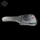 Gray guitar case with red accents on a black background, featuring the Tone Shop logo.