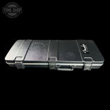 A black hard-shell Fender guitar case with silver latches and a handle, shown against a solid black background. A Tone Shop watermark is visible in the top-left corner.