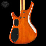 Wooden electric guitar with a visible brand logo on a black background