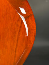 Close-up of a wooden surface with a visible scratch.