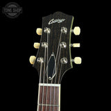 Collings guitar headstock with brand name on a black background