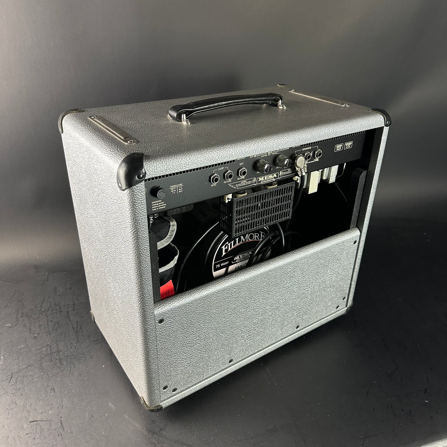 Guitar amplifier with visible brand name on a gray background