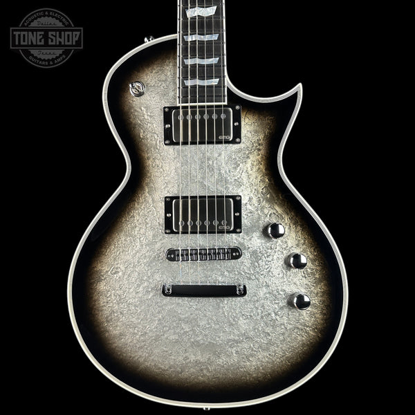 Electric guitar with a textured finish on a black background, featuring the 'Tone Shop' logo.