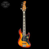 Electric bass guitar with a sunburst finish on a black background, featuring the Tone Shop logo.