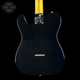 Rear view of a Fender Telecaster electric guitar body in glossy black, with a yellow maple neck visible at the top, shown against a black background.
