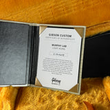 Gibson Custom Certificate of Authenticity on a textured surface