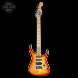 A classic electric guitar with a sunburst finish, shown from the front against a solid black background. The brand headstock is visible but illegible.