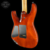 The back of a glossy electric guitar with a natural maple neck, shown against a solid black background. A 'Tone Shop' watermark is visible in the top-left corner.